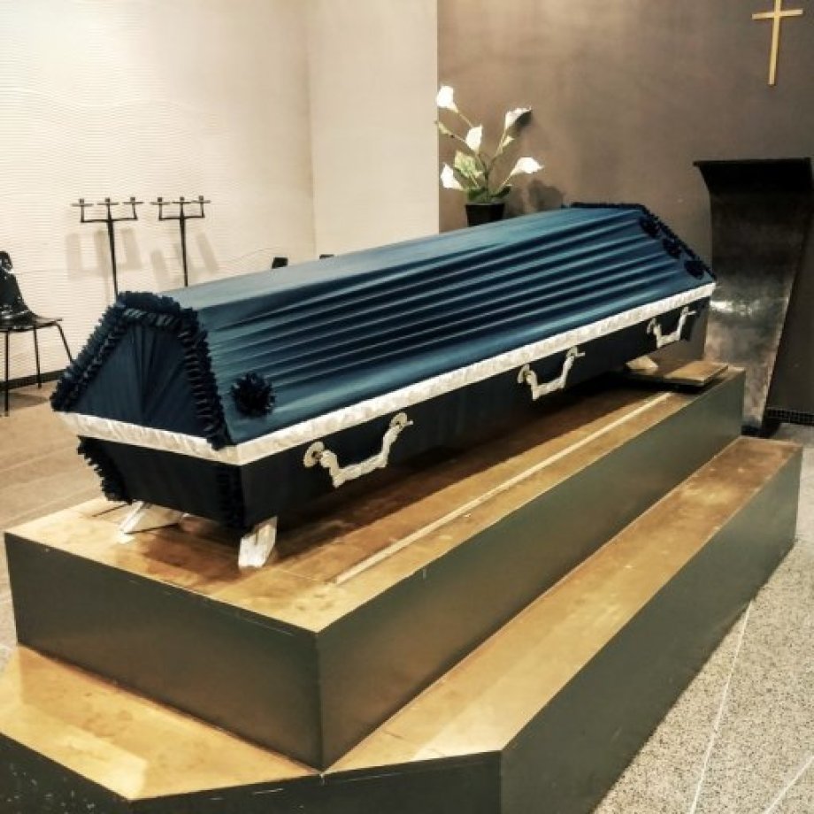 Draped coffin